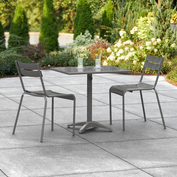A Lancaster Table & Seating outdoor patio table with chairs.