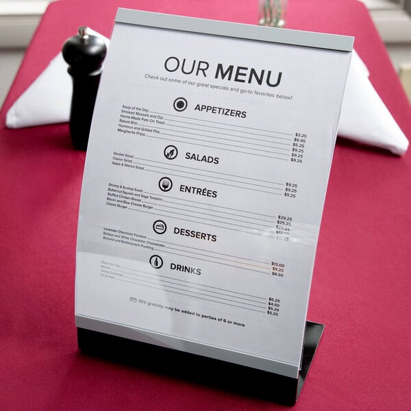 A Tablecraft curved black menu displayette on a table.