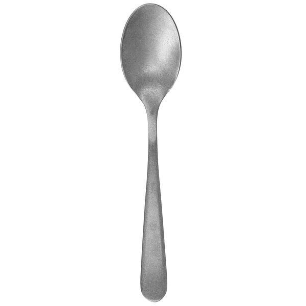 A close-up of a Walco stainless steel demitasse spoon with a fieldstone finish on the handle.