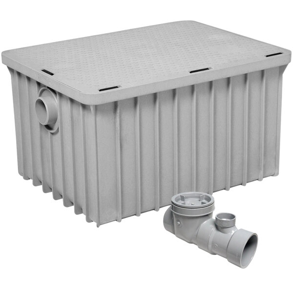 A gray Endura grease trap with threaded connections.