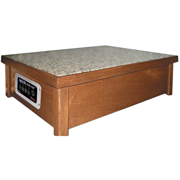 A Spring USA MAX Induction Warmer in a wood cabinet with a SmartStone® top on a countertop.