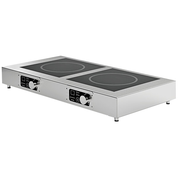 A Spring USA stainless steel double induction warmer on a counter.