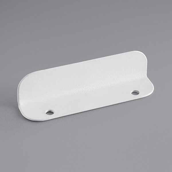 A white rectangular metal handle with two holes in it.