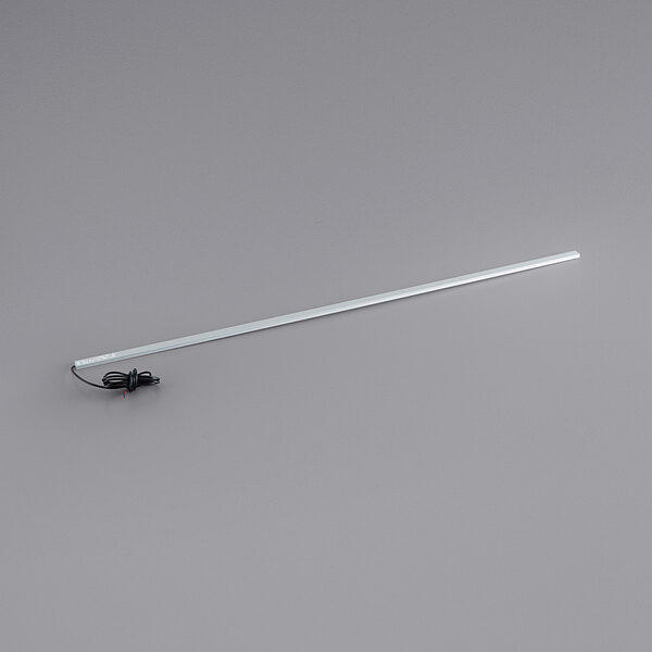 A long white metal rod with a wire and white LED lights on the end.