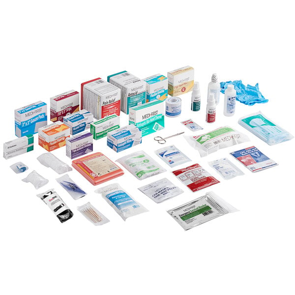 A red rectangular Medique first aid kit refill package with a label.