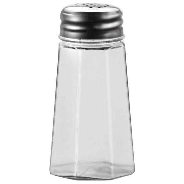 A clear glass shaker with a stainless steel flat top containing salt.