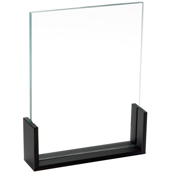 A glass frame with a black frame holding a white background.