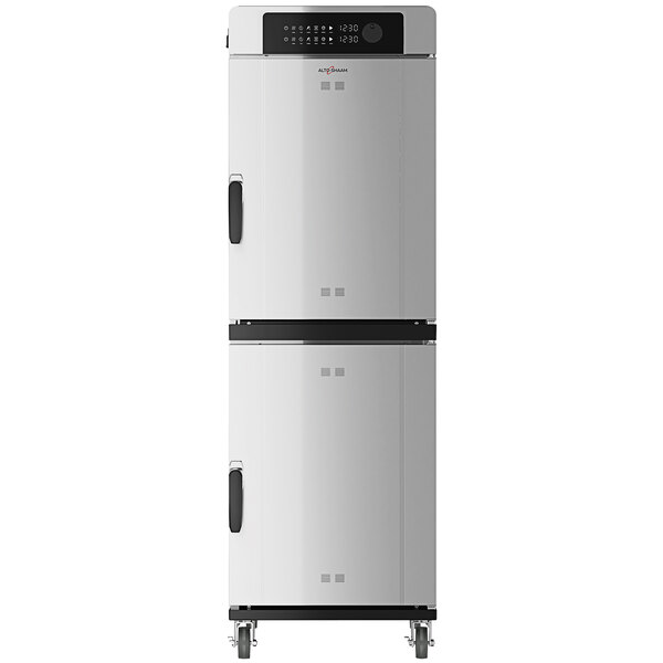 A large white Alto-Shaam smoker oven with black handles on wheels.