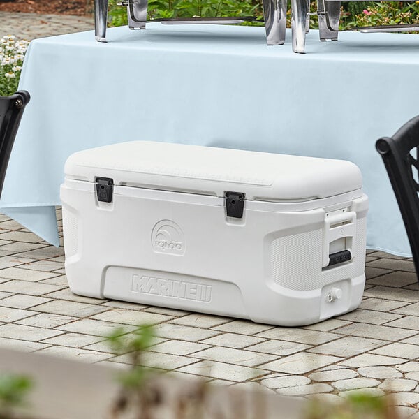 A white Igloo Marine Contour cooler on a table.