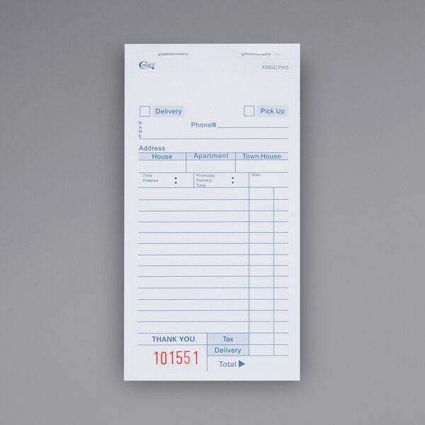 A close-up of a white carbonless order delivery form with red text and lines.