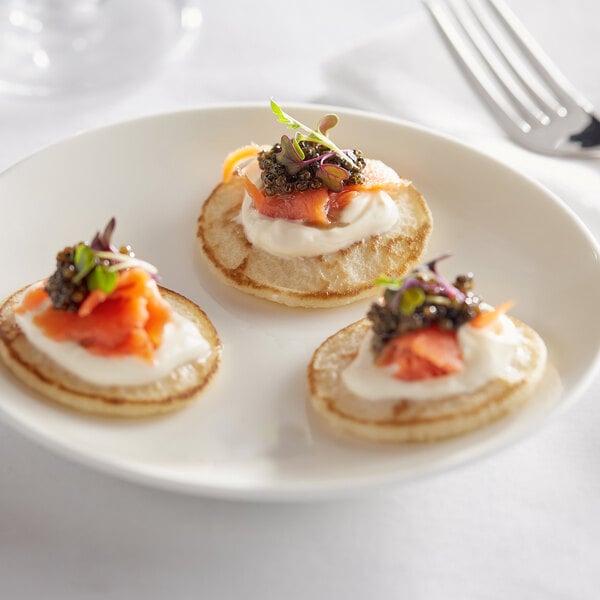 Bemka Traditional French Blini with salmon and cream cheese on a plate.