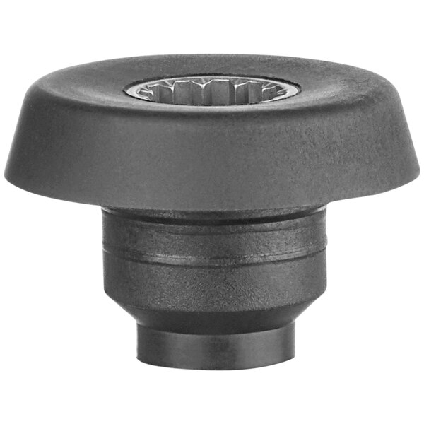 A black plastic Waring drive coupling with a circular center.
