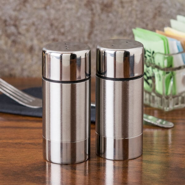 A stainless steel American Metalcraft salt and pepper shaker set on a table.