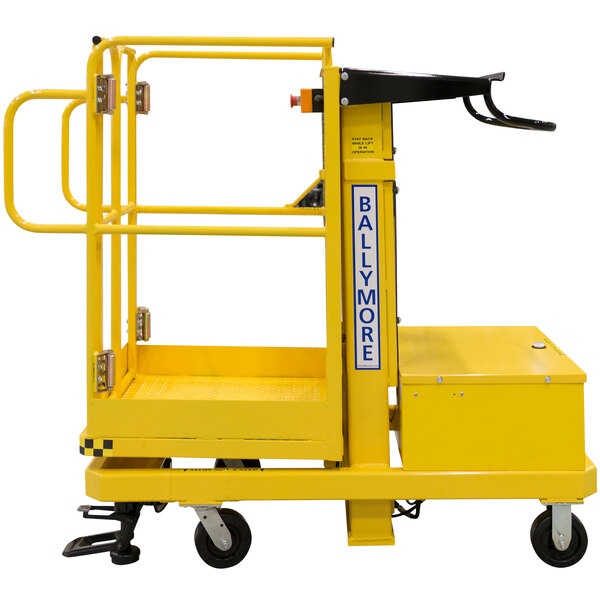 A yellow Ballymore merchandise lift with a black platform.