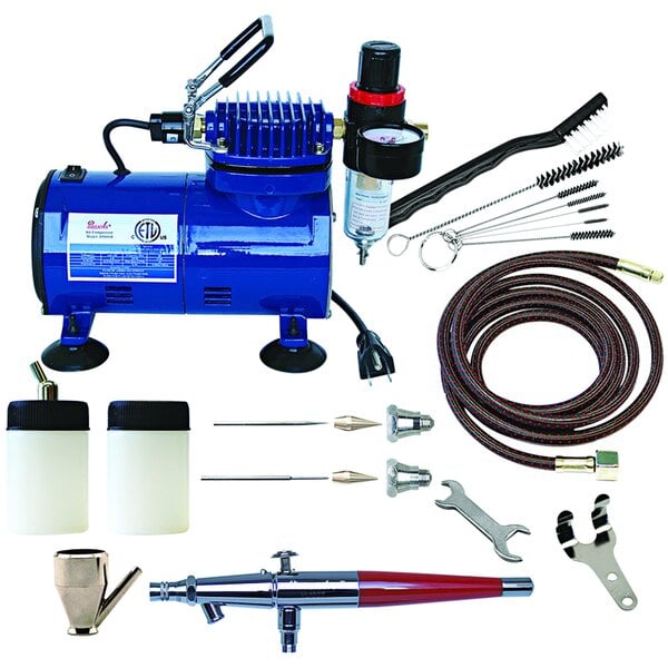 A blue Paasche air compressor with tools and accessories.
