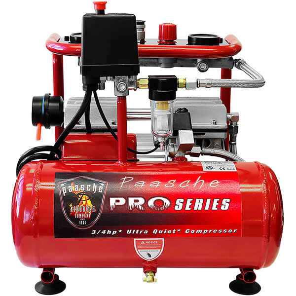 A red and black Paasche air compressor with a black box.