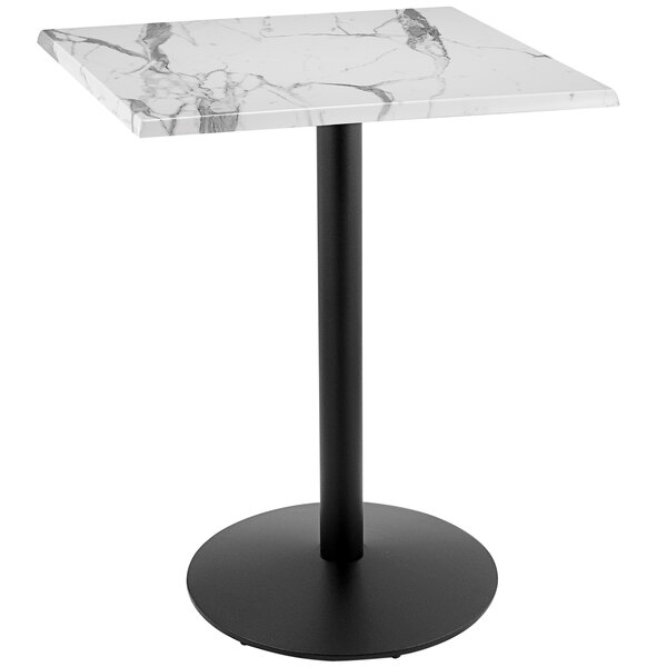 A white marble table with a black round base.