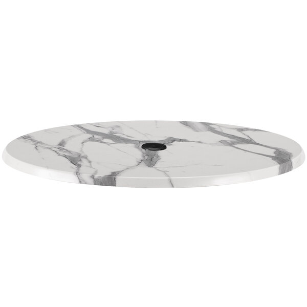 A white marble table top with an umbrella hole.