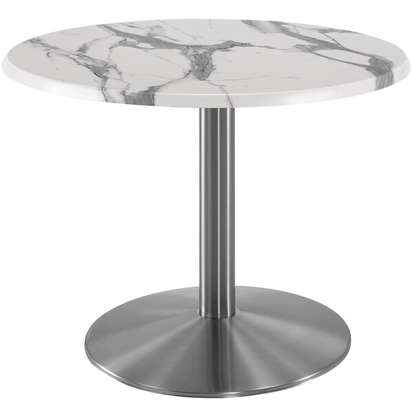 A Holland Bar Stool white marble round table with stainless steel round base.