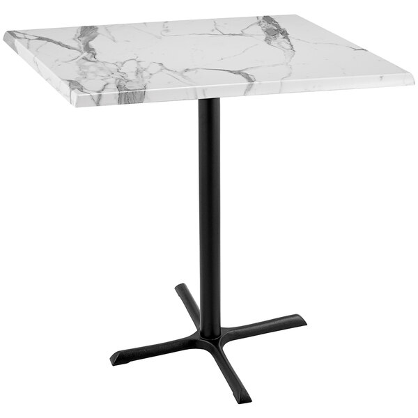 A white marble table with a black base.