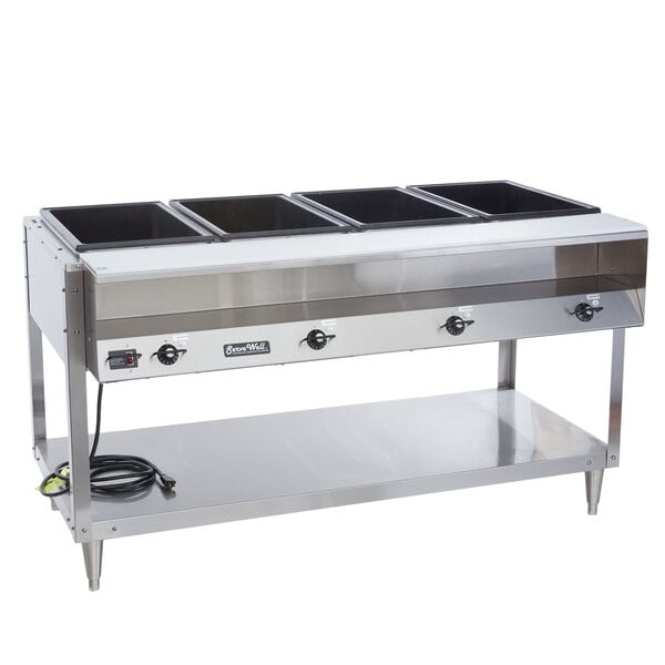 A Vollrath ServeWell electric hot food table with four sealed wells on a counter.