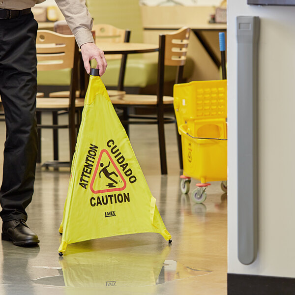 Lavex 30" Caution Wet Floor Pop-Up Sign With Wall-Mounted Case