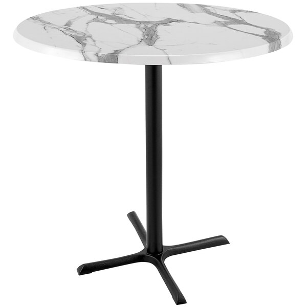 A white marble round Holland Bar Table with a black cross base.