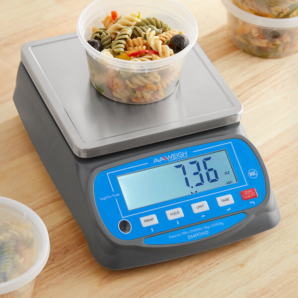 A plastic container of food on an AvaWeigh portion scale.