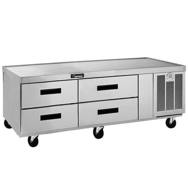 A Delfield stainless steel chef base refrigerator with four drawers.