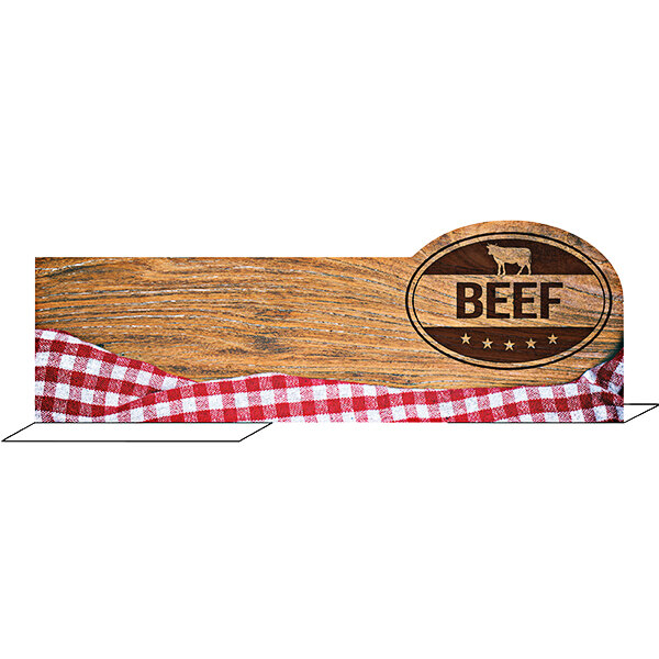 A Ketchum Manufacturing wood beef divider on a wood surface with a checkered tablecloth.