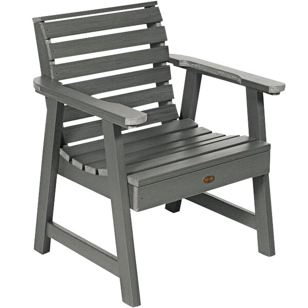 A grey outdoor arm chair with a wooden seat.