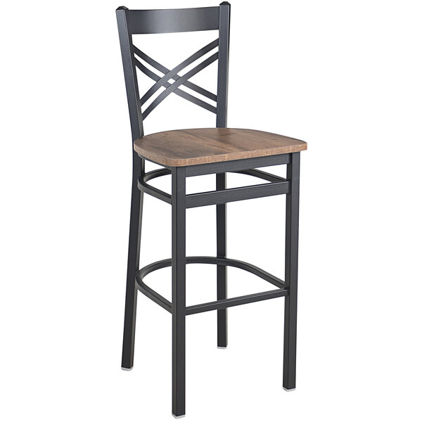 A BFM Seating black steel barstool with a wooden seat and back.
