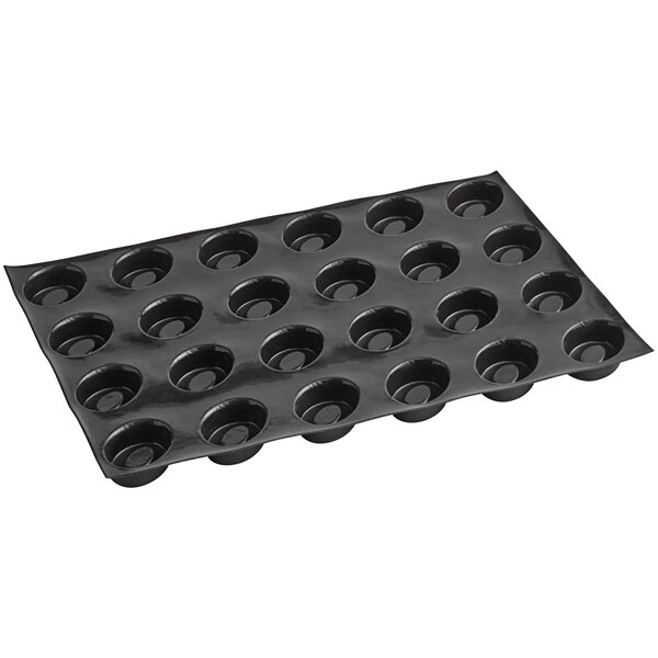 A black Sasa Demarle Flexipan oval tartlet mold tray with 24 indents.