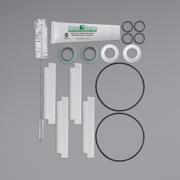 A SaniServ tune-up kit including a brush, toothbrush, and tube brush.