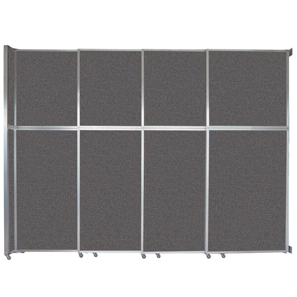 A Versare charcoal gray fabric room divider with wall mounted sliding panels.