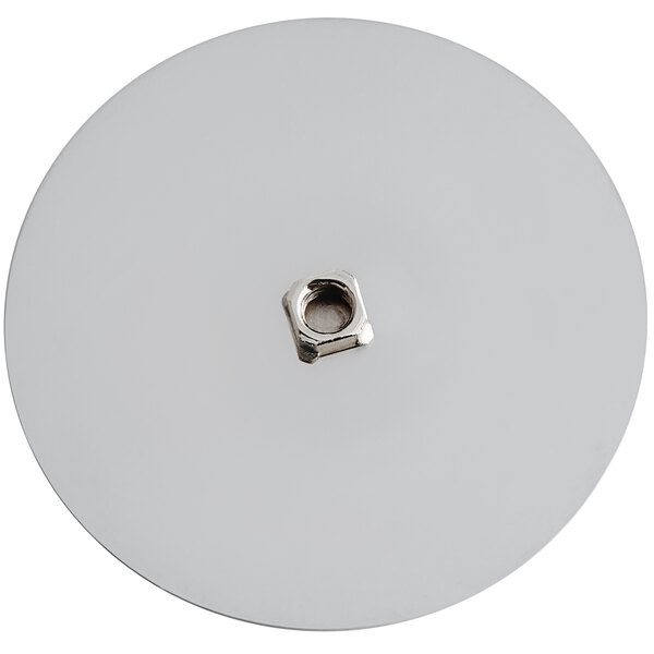 A white round disc with a metal nut on top.