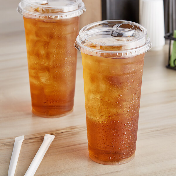 Two Choice clear plastic cups with strawless lids filled with iced tea.