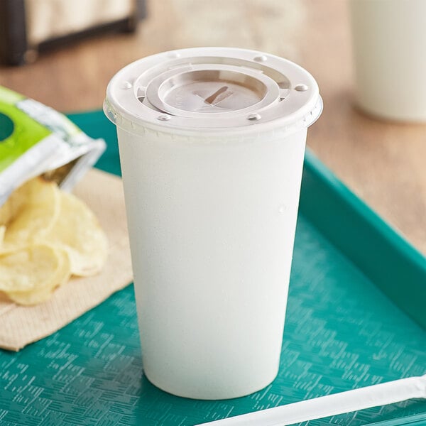 A white plastic Choice cold cup with a lid and straw on a tray.