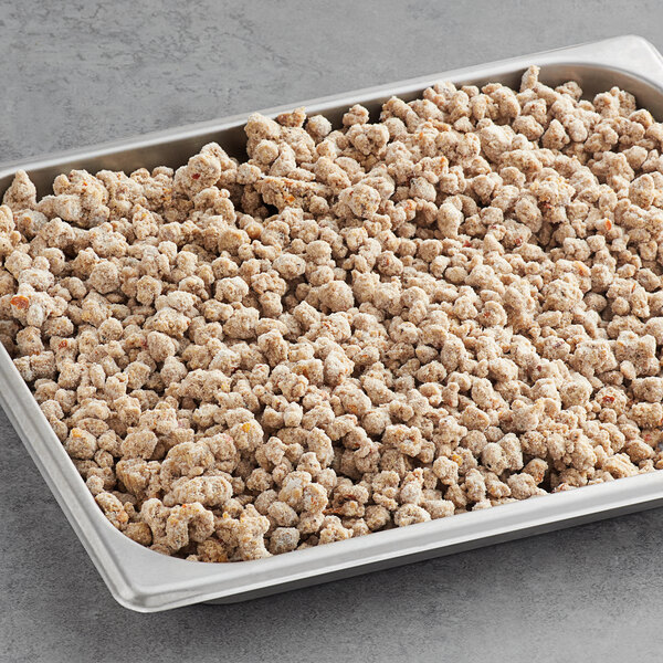 A white tray with Beyond Meat Italian Sausage Crumbles on a table.