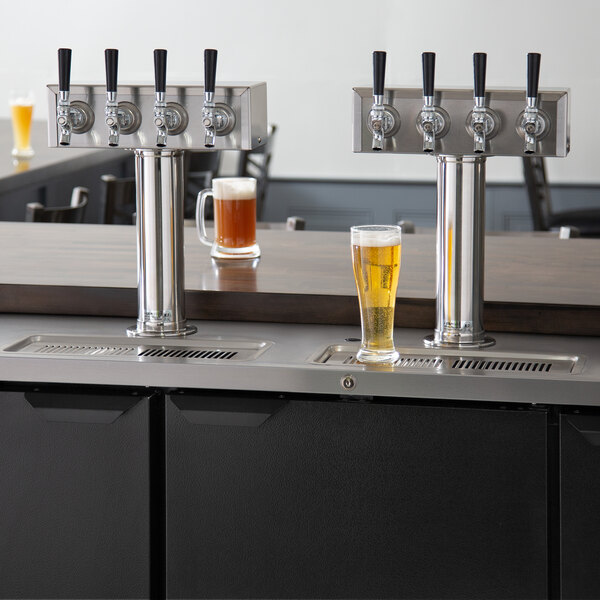 A Beverage-Air kegerator with four taps on a counter.