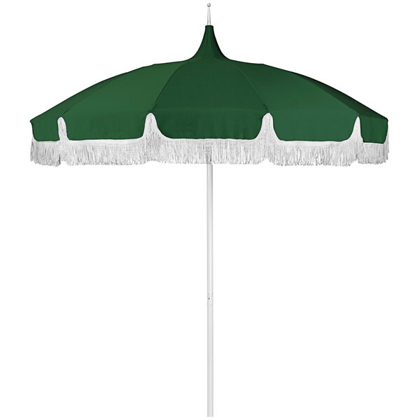 A green umbrella with a white fringe and pointy top.