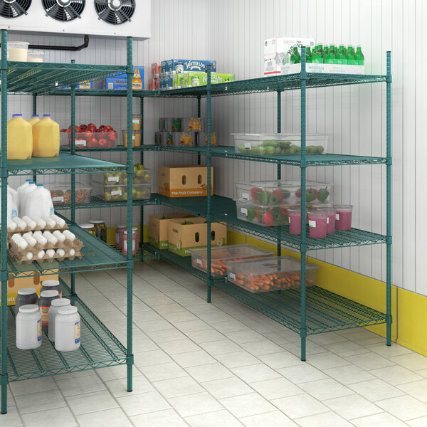 A green metal Regency wire shelving unit in a room in an organic food store with food items on the shelves.