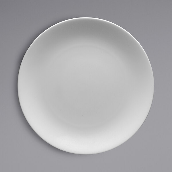 A white Fortessa Caldera china plate on a grey background.