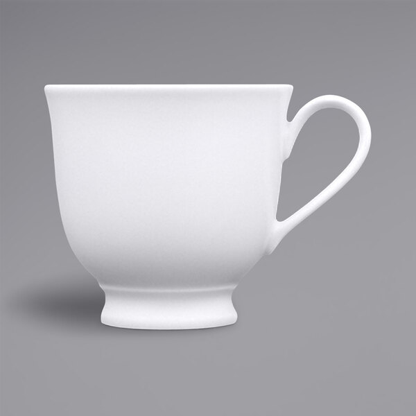 A white Fortessa Ilona china cup with a handle.