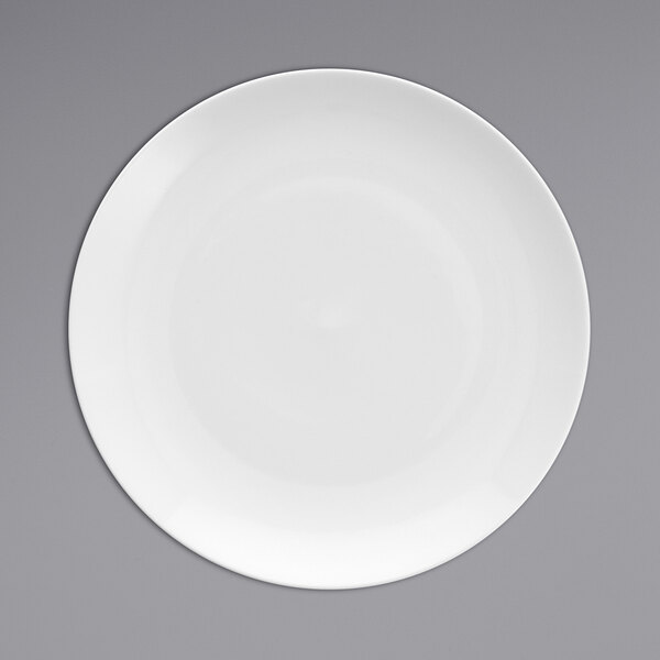 A close-up of a Fortessa Caldera bright white china plate with a white rim.