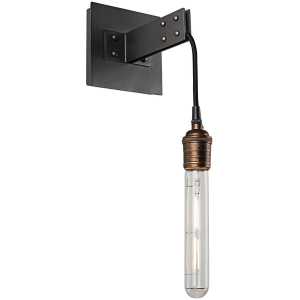 A Kalco Stuyvesant industrial wall sconce with a clear Edison bulb attached.