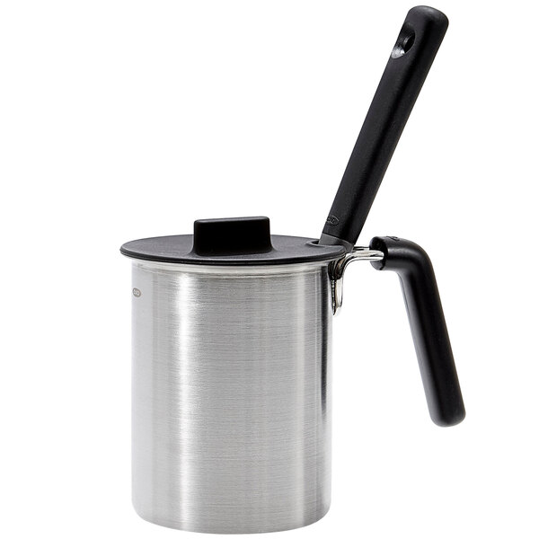An OXO stainless steel basting pot with a black handle.