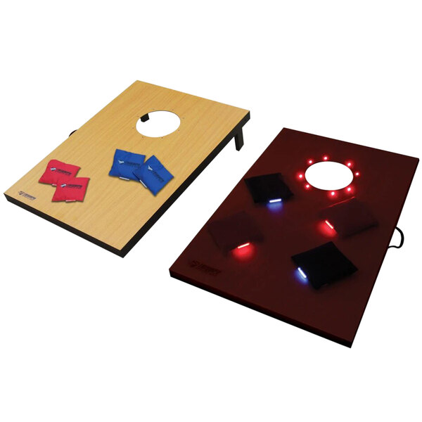 A rectangular Triumph cornhole game set with lights on the boards.
