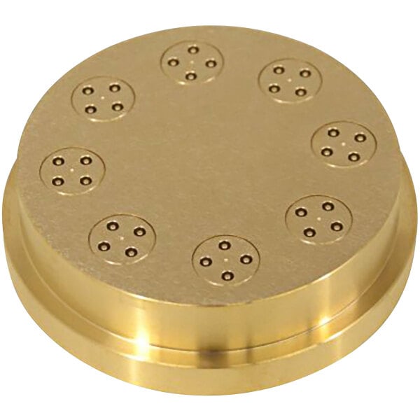 A gold circular brass disc with holes in it.