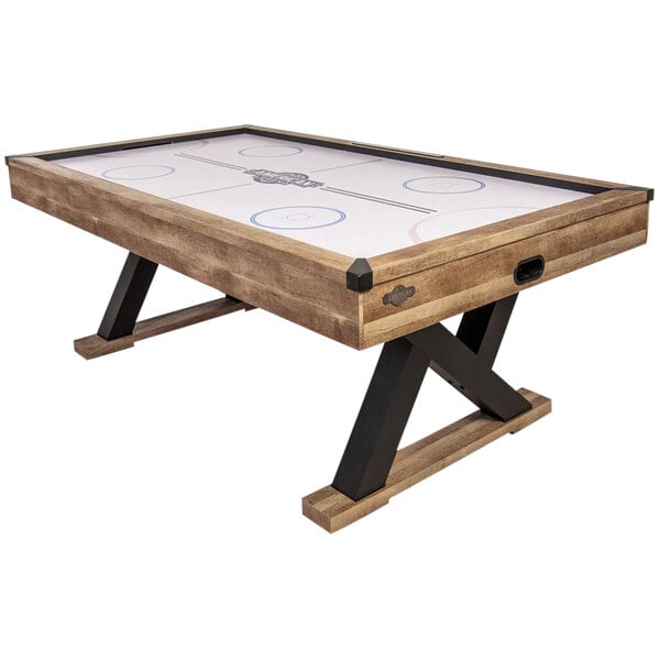 An American Legend Kirkwood air hockey table with a white wood surface.